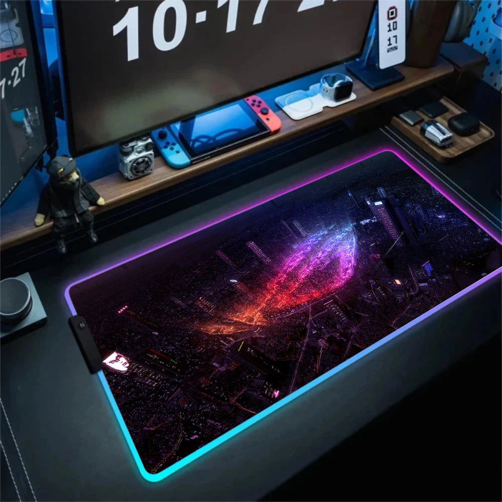 Gaming desk setup with a large mouse pad featuring a colorful cityscape design.