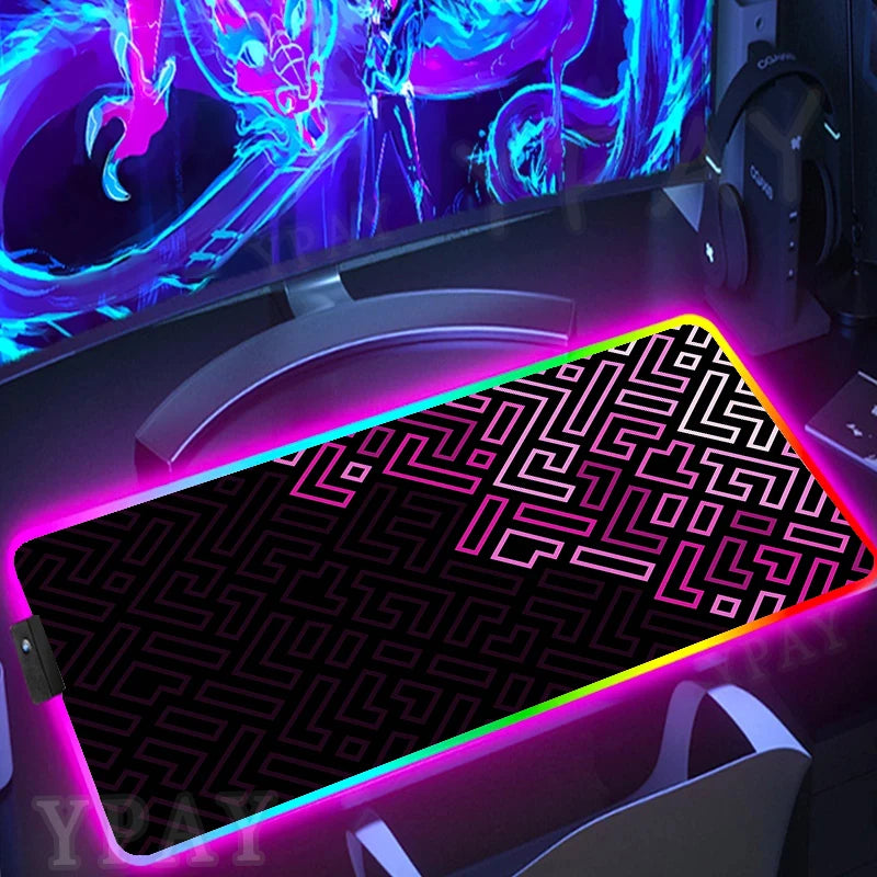 Gaming setup with a large mouse pad featuring a maze pattern and colorful lighting.
