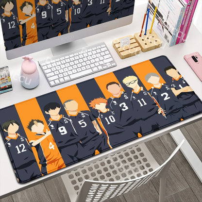 Desk setup with a large mouse pad featuring animated characters and sports jerseys.
