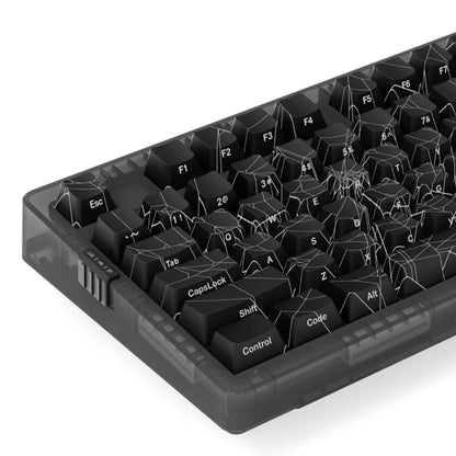 Black keyboard with spider web design on keys against a white background
