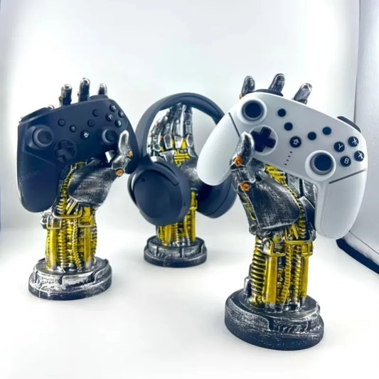 Three robot hand sculptures with controllers on a white background