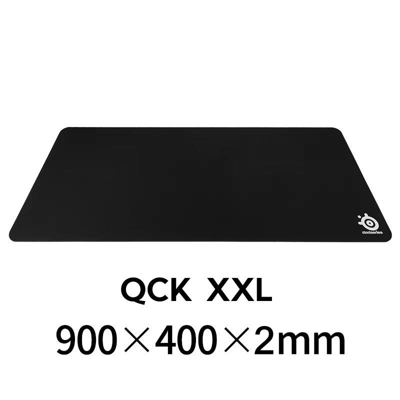 Black gaming mouse pad with 'QCK XXL' and dimensions on a white background