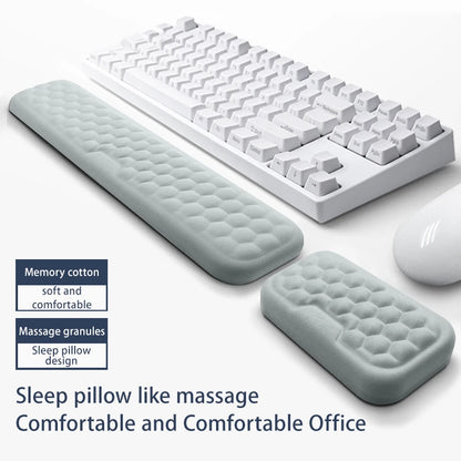 White keyboard with wrist rest and mouse on a white background