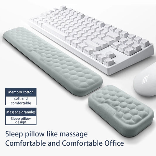 White keyboard with wrist rest and mouse on a white background