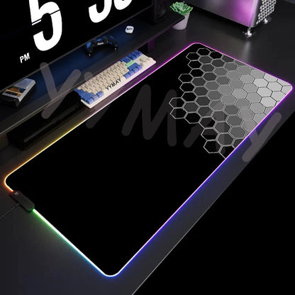 Large gaming mouse pad with RGB lighting on a desk setup