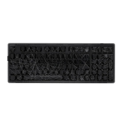 Black mechanical keyboard with spider web design on a white background