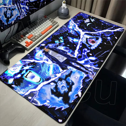 Gaming desk setup with a large mouse pad featuring anime-style artwork.