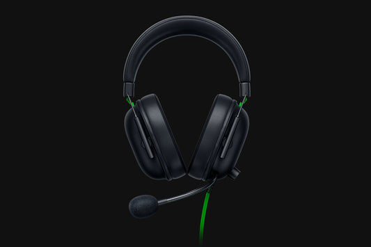 Black gaming headset with a microphone on a black background