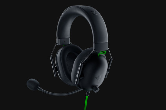Black gaming headset with microphone on a black background